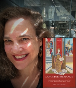 Julie Stone Peters with a copy of her book, Law as Performance: Theatricality, Spectatorship, and the Making of Law in Ancient, Medieval, and Early Modern Europe, featuring a medieval illustration of a seated figure holding an open book.