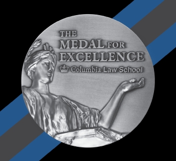 The Medal for Excellence, a silver circular medal with a low relief of Alma Mater on it.