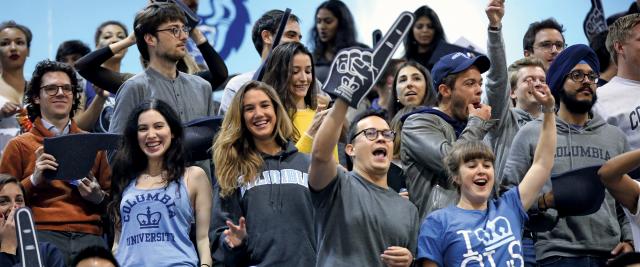 Students cheer at the Dean's Cup basketball game.
