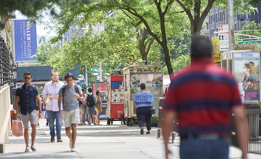Food carts line the sidewalk on Broadway outside Columbia.