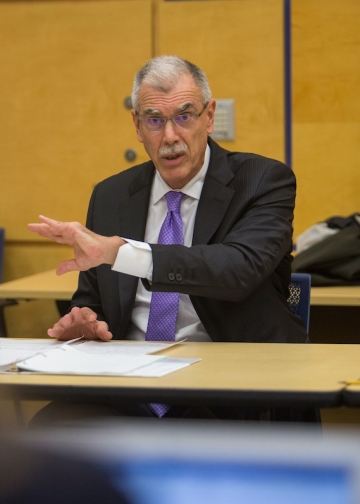 Donald B. Verrilli Jr. ’83 in a suit and tie teaching in a classroom at Columbia Law School.