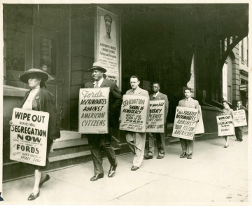 Paul Robeson marches with members of the Baltimore chapter of the NAACAP in a picket line in front of Ford’s Theater, Baltimore, to protest the theater’s policy of racial segregation