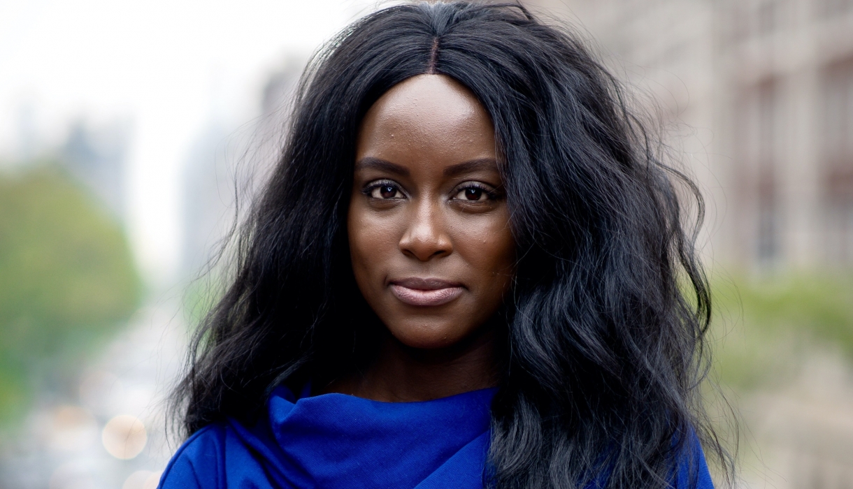 Columbia Law Review Editor in Chief Oluwatumise Asebiomo in blue dress