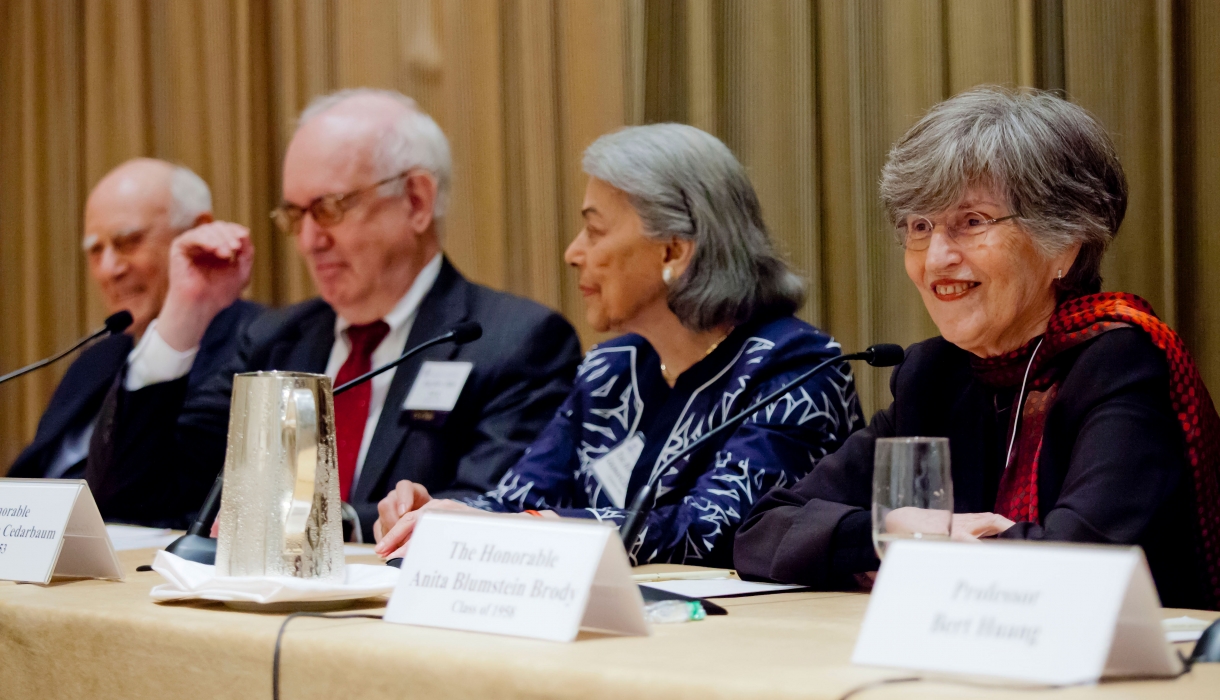 Panelists sit at a table at the 2013 Reunion panel "Judging Without Trials"