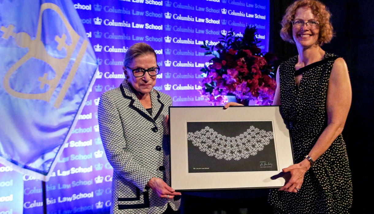 Dean Gillian Lester presents Ruth Bader Ginsburg with a custom made lace collar.