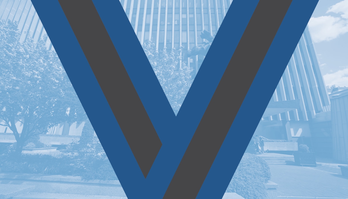 The blue ribbon of the Medal for Excellence superimposed on an image of the Law School