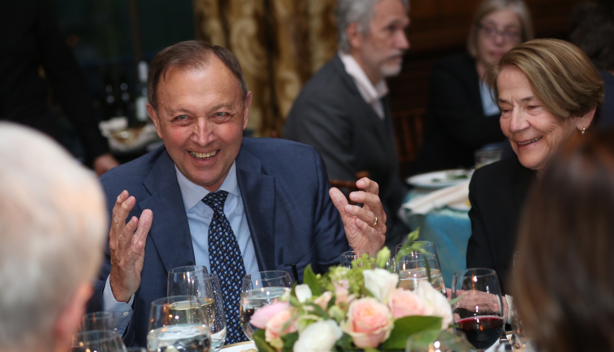 Man in a suit at a dinner event 