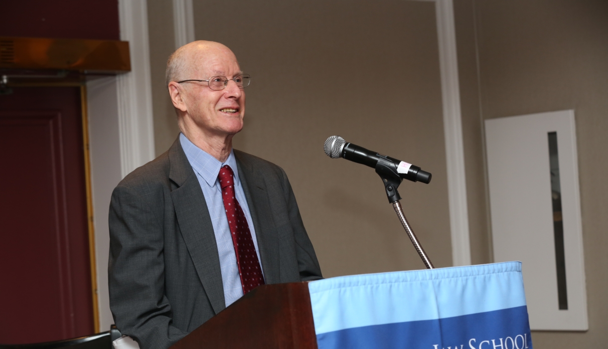 Man standing behind a podium