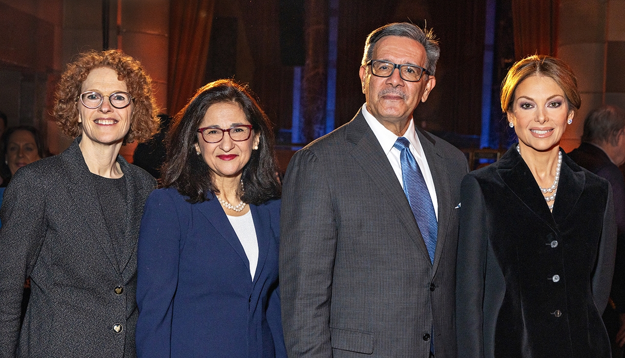 Three women and one man in business attire