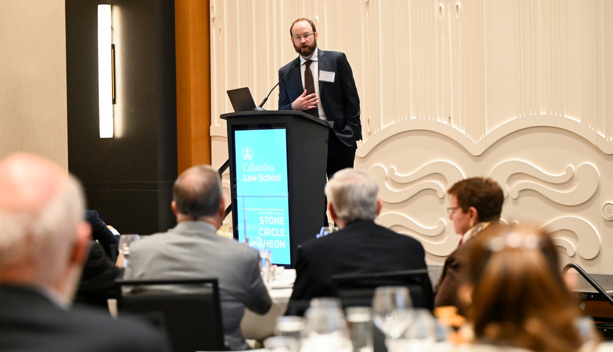 Professor Jeremy Kessler at a podium