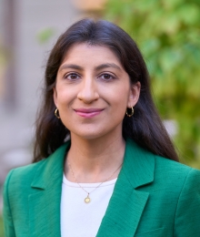 Professor Lina Khan smiling outside Columbia Law School