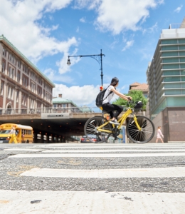 Student biking on Amsterdam and 116th Street