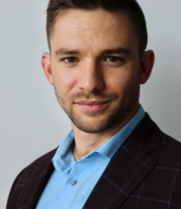 Bearded man in bright blue shirt