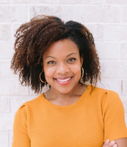 A woman in short sleeved orange dress