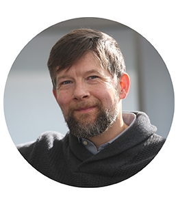 Portrait of man with beard and. short hair in sweater