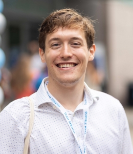 Adam Burstain smiling at Orientation