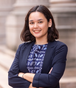 Woman wearing a blue blazer and blue patterned shirt