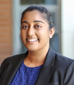 Woman in a blue blouse and black blazer