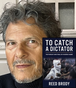 Reed Brody with a copy of his book To Catch a Dictator: The Pursuit and Trial of Hissène Habré