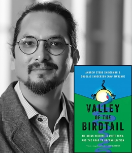 Douglas Sanderson with a copy of his book, Valley of the Birdtail: An Indian Reserve, a White Town, and the Road to Reconciliation, featuring an illustration of a stream in a valley made from the tail of a bird.
