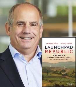 Howard Wolk with a copy of his book Launchpad Republic: America’s Entrepreneurial Edge and Why it Matters 