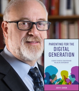 Jon Garon with a copy of his book, Parenting for the Digital Generation: A Guide to Digital Education and the Online Environment