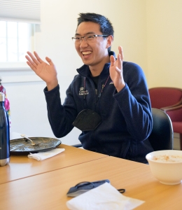 Young man gesturing in conversation