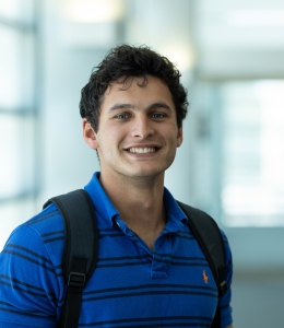 Student with backpack over his shoulders