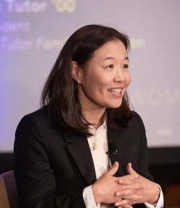 Woman in black blazer and white shirt