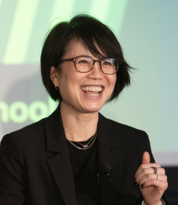 Woman in glasses and black blazer