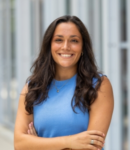Woman outdoors in blue sleeveless shirt
