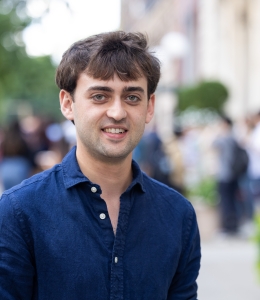 Man outdoors in blue shirt