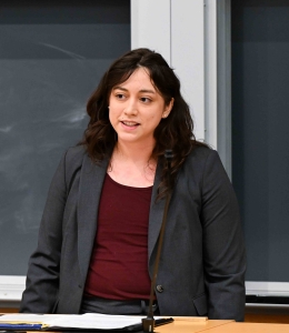 Nicole Morote stands behind a podium.