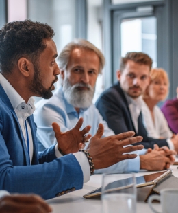 Employee talking at a conference table