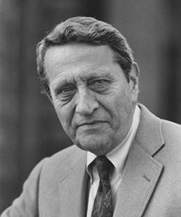 Black and white portrait of a man in a suit and tie