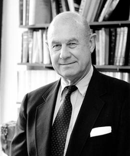 Black and white photo of man in suit and tie