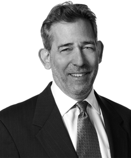 Pictured above is a black and white image of  Steven G. Horowitz in a suit and tie. 
