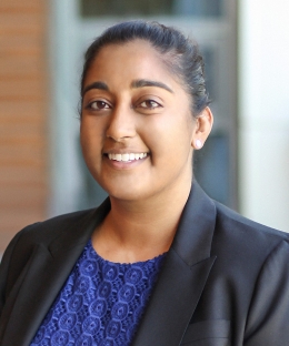 Woman in a blue blouse and black blazer