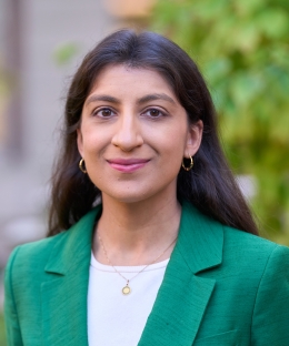 Professor Lina Khan smiling outside Columbia Law School
