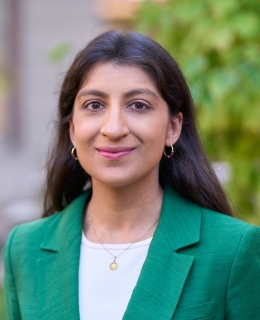 Professor Lina Khan smiling outside Columbia Law School