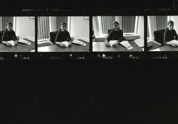 Ruth Bader Ginsburg sits at her desk as a professor in the 1970s.