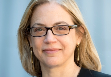 Columbia Law Professor Gillian Metzger in glasses and light blue sweater and dark blazer