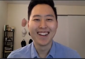 Justin Yun in front of his computer at home