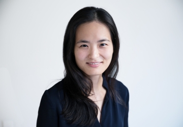 Portrait of Sarah Seo in black against a white background. 