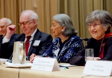 Panelists sit at a table at the 2013 Reunion panel "Judging Without Trials"