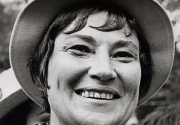 Black and white headshot of Bella Abzug smiling 