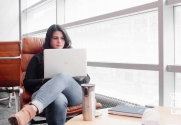 Amanda Soto Fontes ’18 LL.M. studies on a laptop in Jerome Greene Hall.