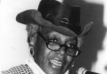 Flo Kennedy speaking at a mic. Credit: Schlesinger Library, Radcliffe Institute, Harvard University