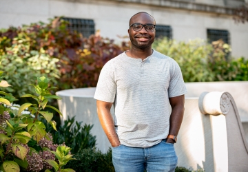 Kodjo Kumi standing on campus