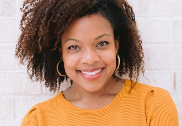 A woman in short sleeved orange dress